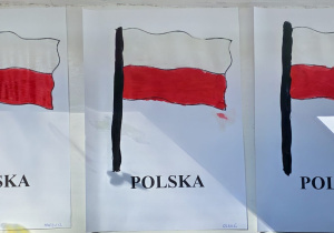 Prace dzieci z grupy Pszczółek - flaga państwowa namalowana farbami - białą, czarną i czerwoną