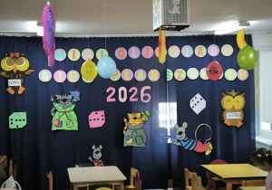 Dekoracja z napisem "Mini Olimpiada Gier Planszowych 2026"