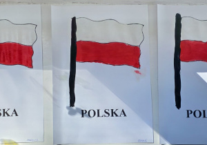 Prace dzieci z grupy Pszczółek - flaga państwowa namalowana farbami - białą, czarną i czerwoną